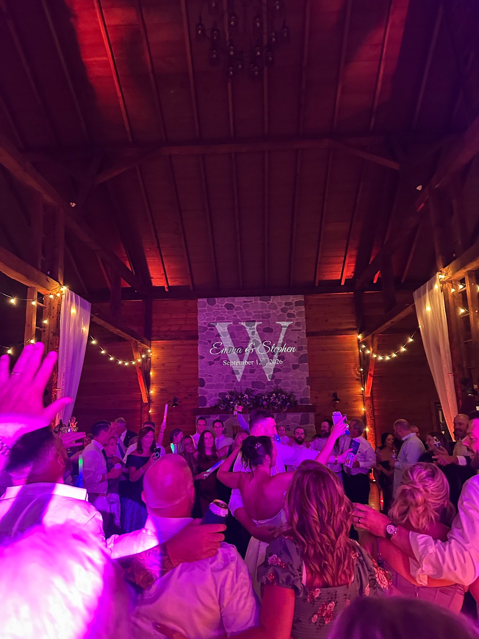 Packed wedding dance floor during a DJ reception